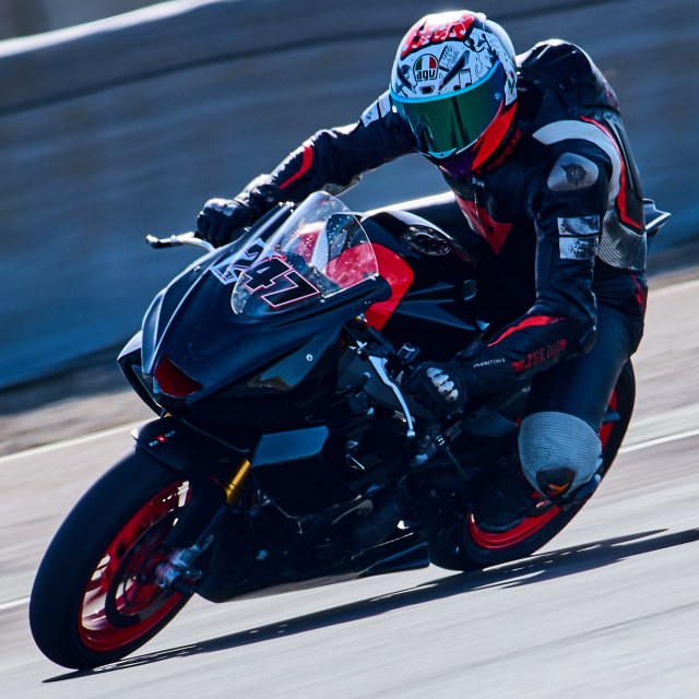 Rider one in a circuit corner, view 2
