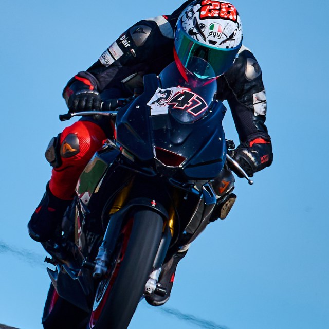 Rider one in a circuit corner, view 3