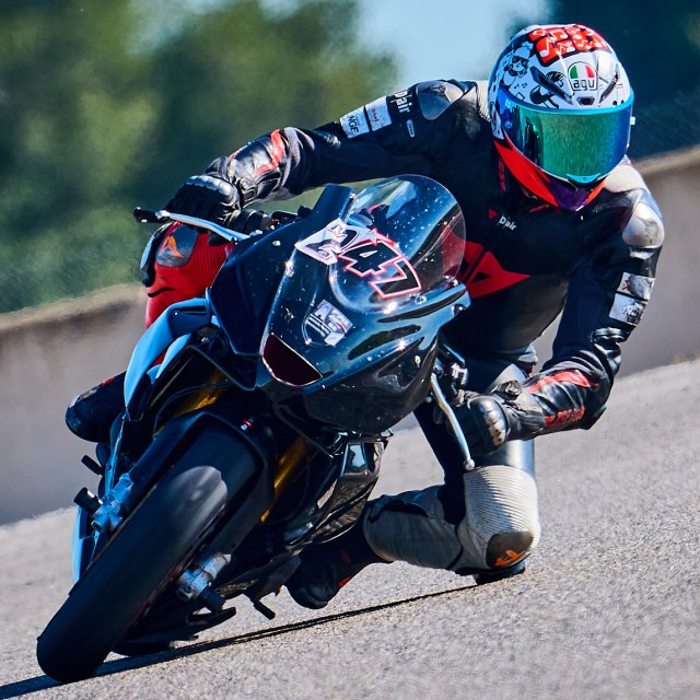 Rider one in a circuit corner, view 4